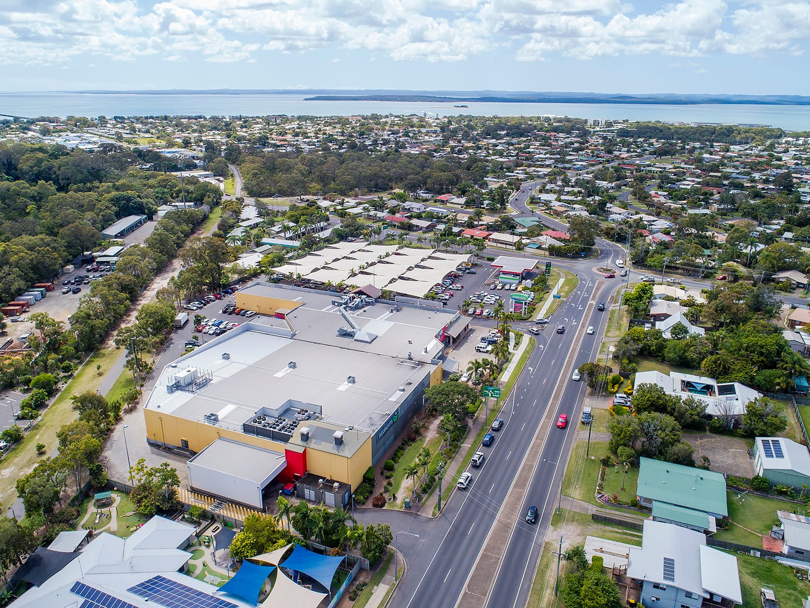 Aerial view of Urangan Central Shopping Centre with Hervey Bay in the background