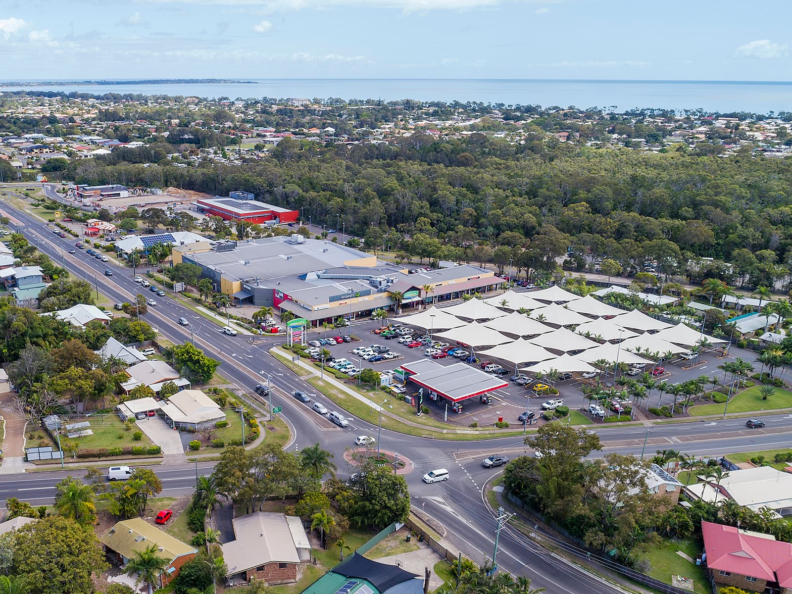 Aerial view of Urangan Central Shopping Centre on Elizabeth St with Hervey Bay in the background